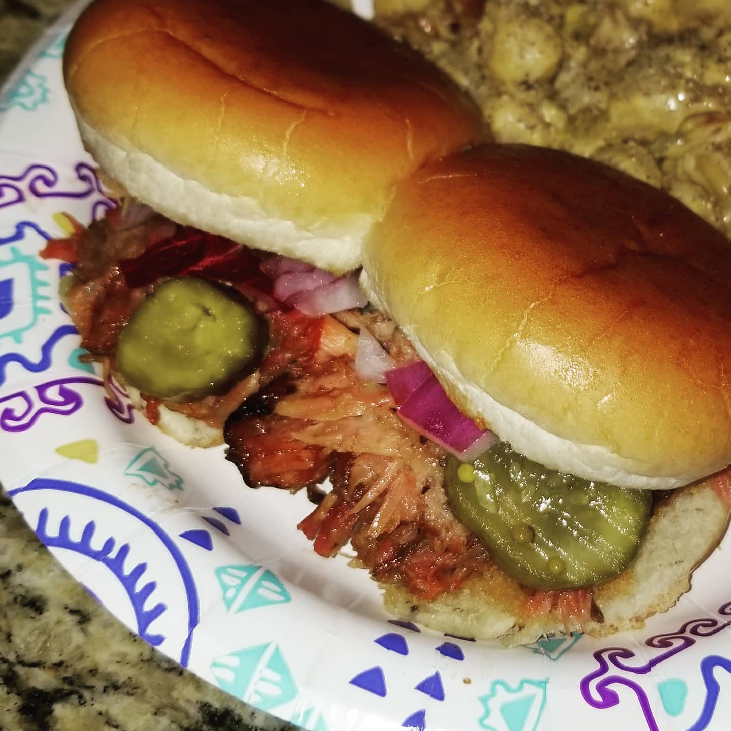 Some homemade ribwich sliders with some bacon green chile mac and cheese on the side.  Smokin Sundays